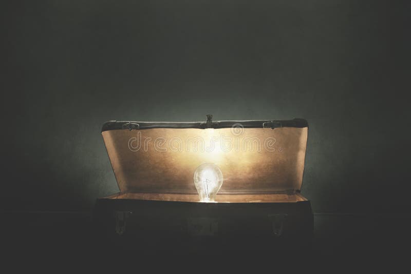Bulb light comes out of a mysterious open suitcase, concept of idea and invention royalty free stock images