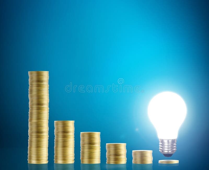 Bulb With Stack Of Coins stock image
