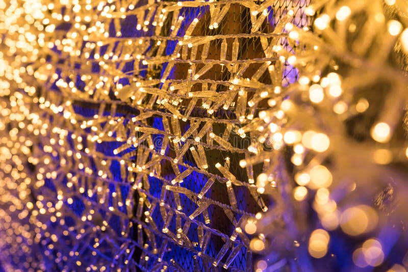 Bulbs glitter in tunnel lights and gold bokeh background. stock photos Bulbs glitter in tunnel lights and gold bokeh background. stock photos