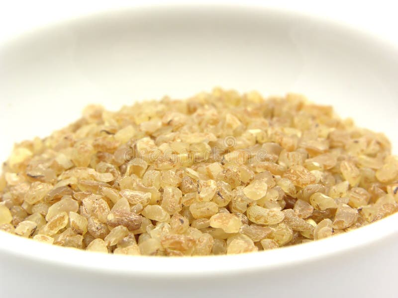 A close-up view on bulgur wheat groats in a bowl of chinaware