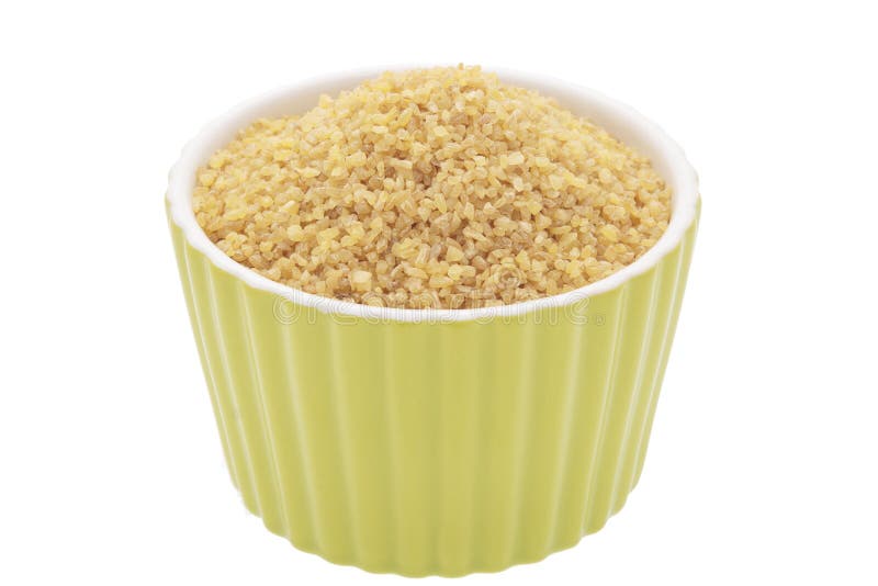 Uncooked bulgur wheat in a bowl on a white background
