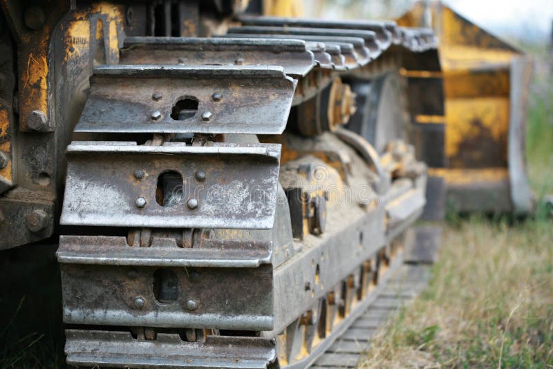 The tracks of a bull dozer excavating machine. The tracks of a bull dozer excavating machine.