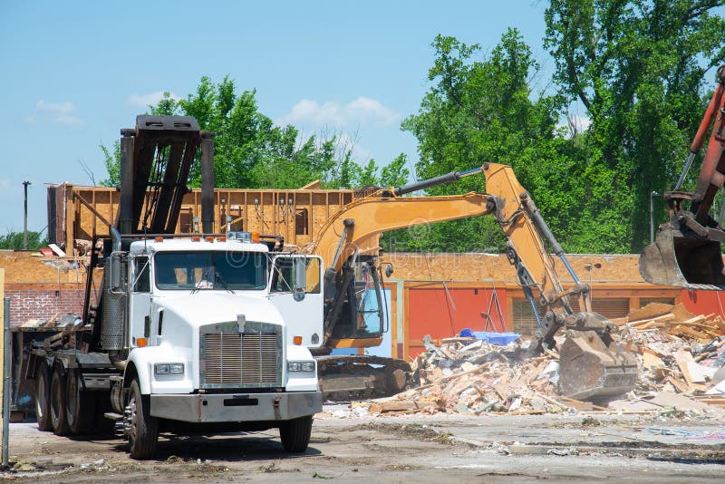 Bulldozer Loading Demolition Debris and Concrete Waste for Recycling at