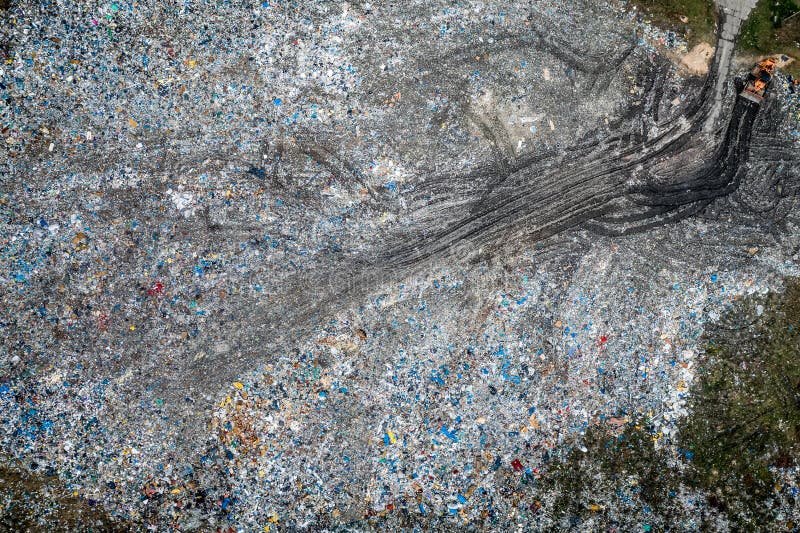 Bulldozer on Open Solid Waste Dump, Poland from Above Stock Image