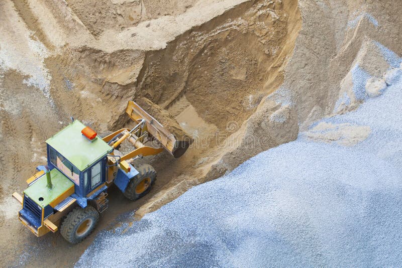 File Bulldozer working on sand and rock field in construction site use for road and civil construction and land development ,mining field