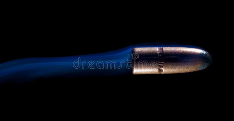 Bullet flying with smoke stock image