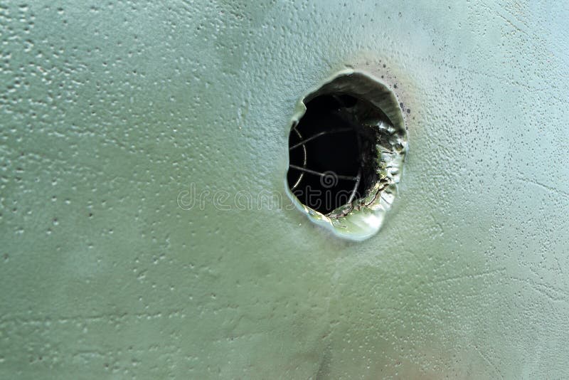 The bullet hole in the armor of the tank royalty free stock images