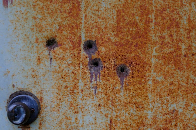 Bullet Holes in Rusty Metal Door 2 Stock Photo Image of cinder