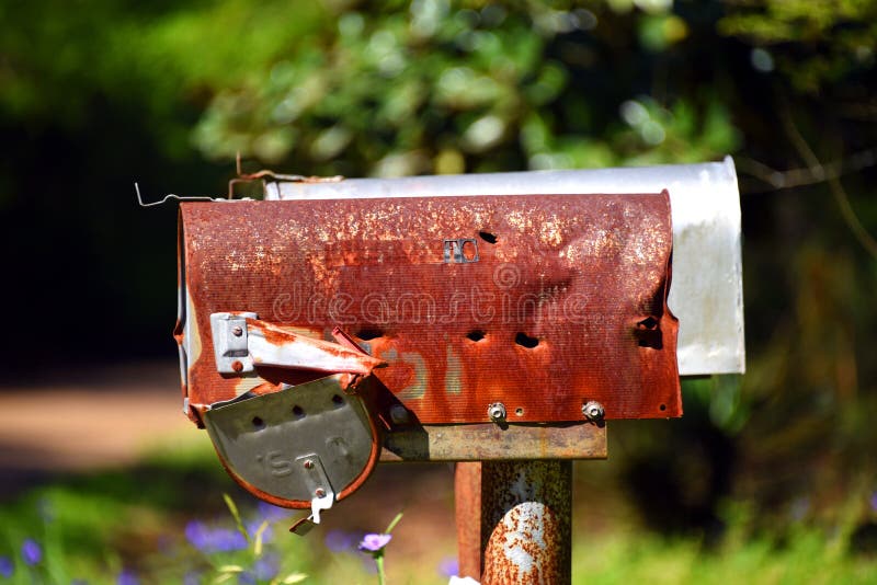 Bullet Holes in Rusty Rural Mailbox