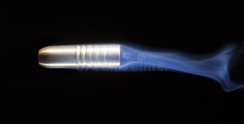 Bullet and smoke stock photography