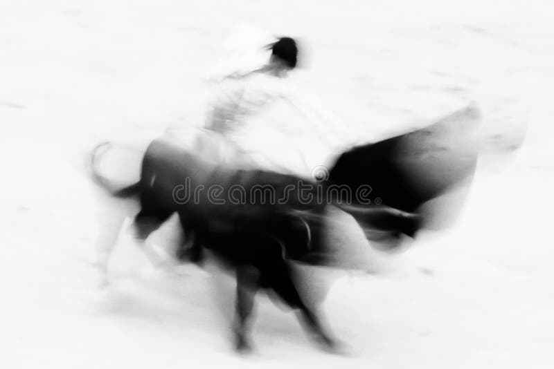 Bullfigting in bullring Las Ventas, Madrid, Spain. Abstract black and white image. Bullfigting in bullring Las Ventas, Madrid, Spain. Abstract black and white image.