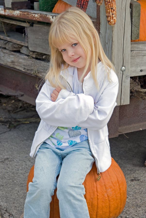 Bumpkin on Pumpkin stock photo. Image of innocence, innocent - 11160394
