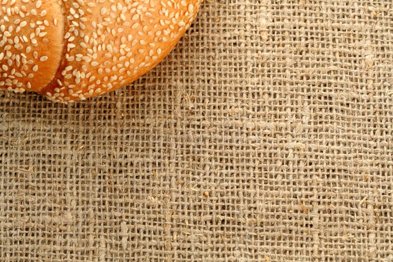 Bun with sesame on background stock photography
