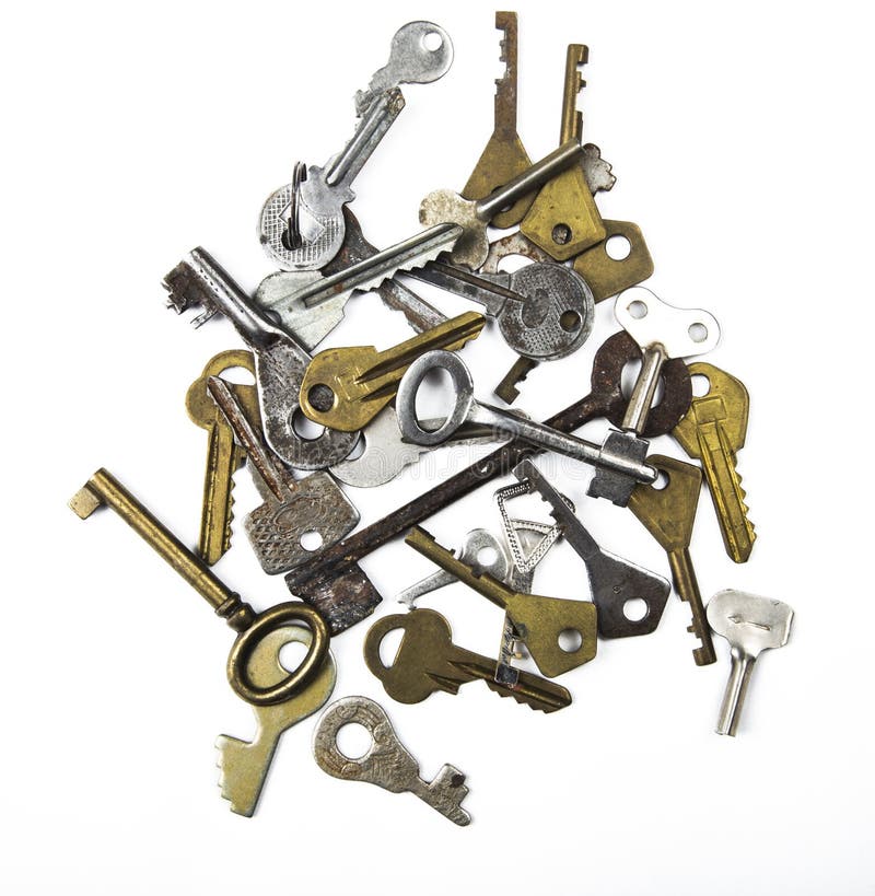 Bunch of assorted old multi-colored metal antique keys of different shapes isolated on white background. Home security concept royalty free stock photo Bunch of assorted old multi-colored metal antique keys of different shapes isolated on white background. Home security concept royalty free stock photo