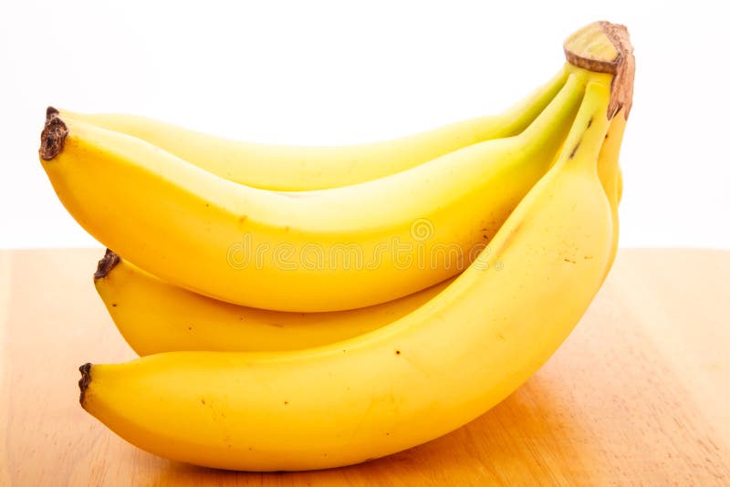 Bunch Of Bananas On Wood Table With White Background Stock Image