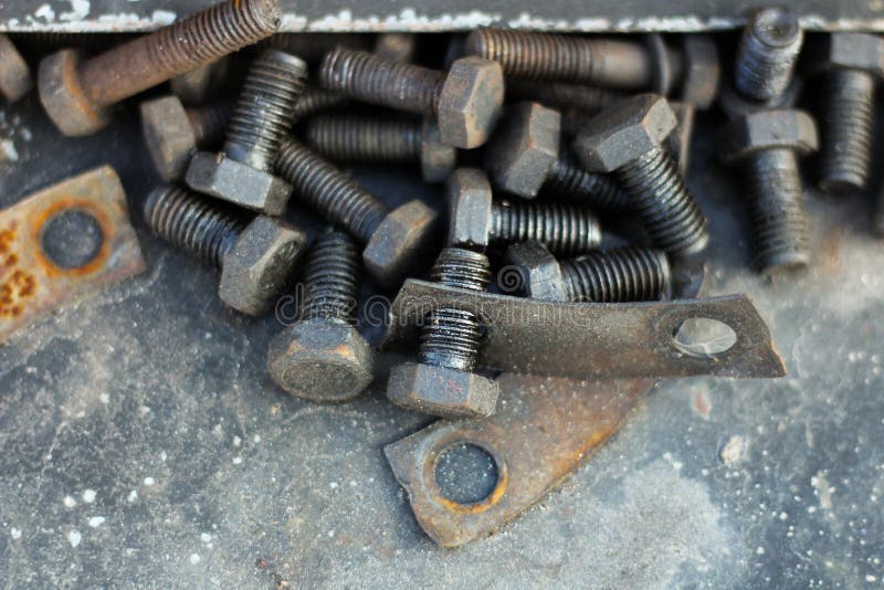 A Bunch of Big Screws Smeared with Engine Oil Stock Photo Image of