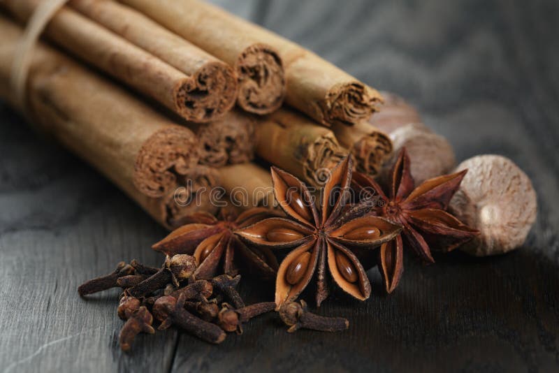Bunch of Cinnamon Sticks with Nutmeg, Anise and Cloves Stock Image