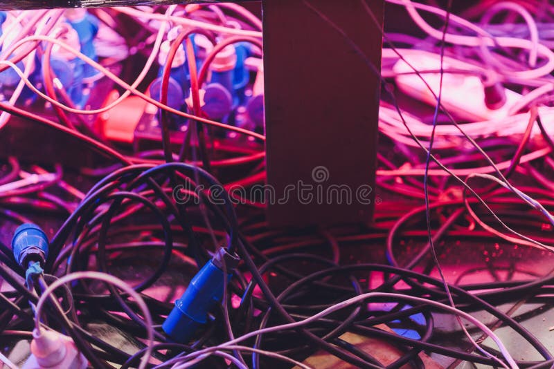 The bunch of electric wires of different colors are very much intertwined. Tangled wire-end ferrules and markings. Wire stock photo The bunch of electric wires of different colors are very much intertwined. Tangled wire-end ferrules and markings. Wire stock photo