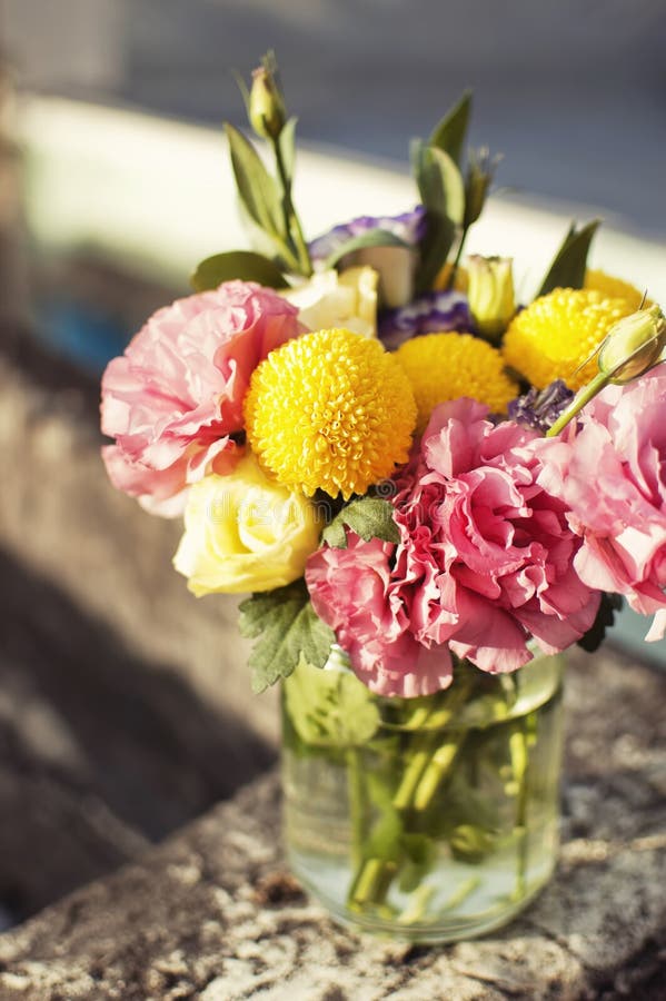 Bunch of flowers in a glass jar