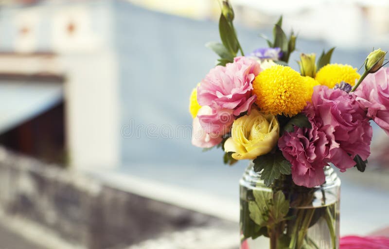 Bunch of flowers in a glass jar