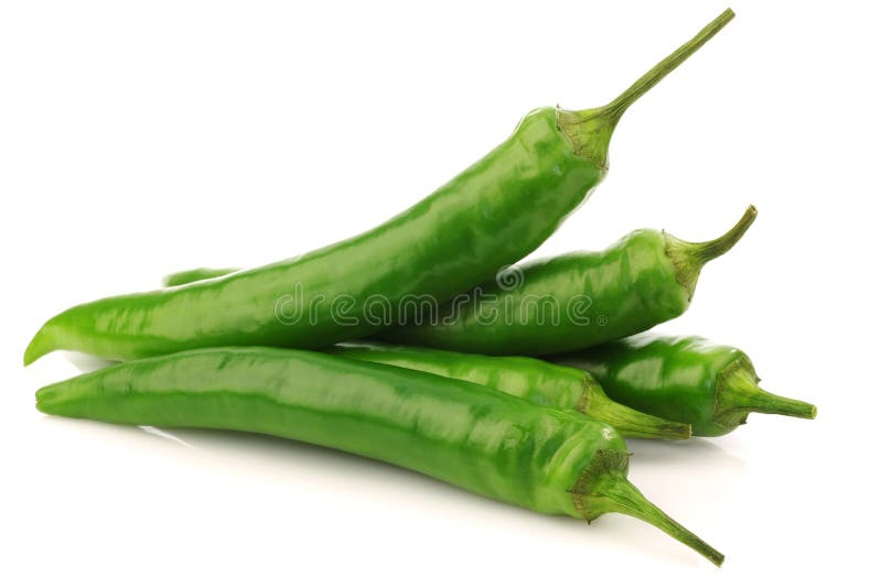 Bunch of fresh green chili peppers on a white background