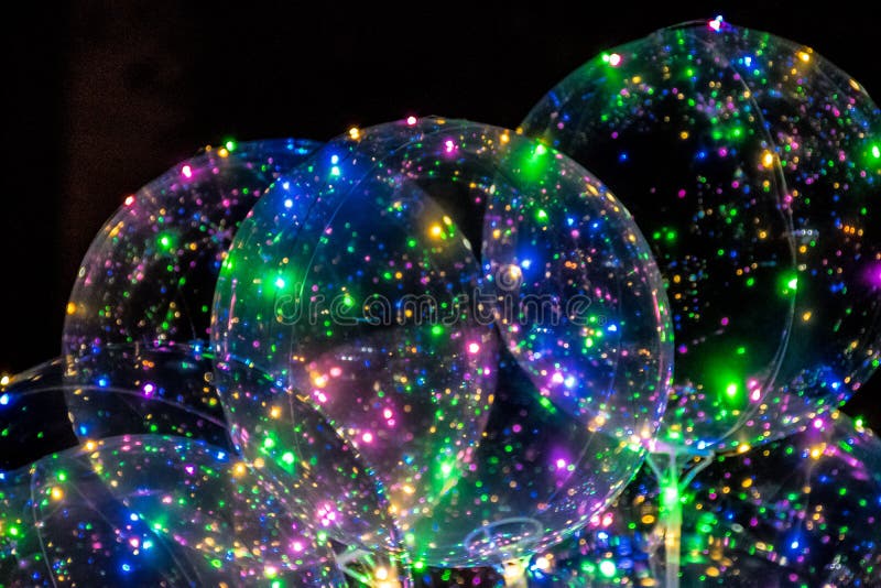 A bunch of glowing balloons with LED lights