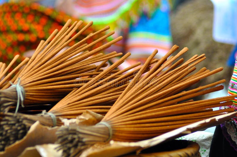 Bunch of Incense Sticks in a Brass Vessel Burning and Releasing