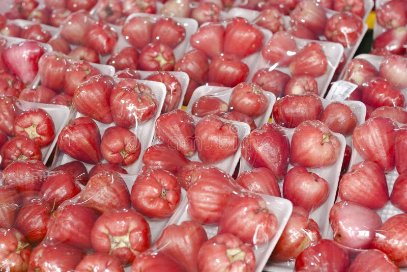 A bunch of juicy pink and red water apples