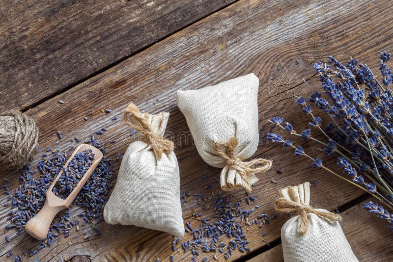 Bunch of lavender flowers and sachets filled with dried lavender. Top view. Flat lay.