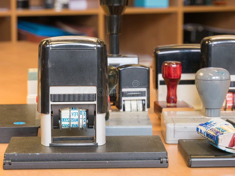 Bunch of old office stamp on a desk stock photo