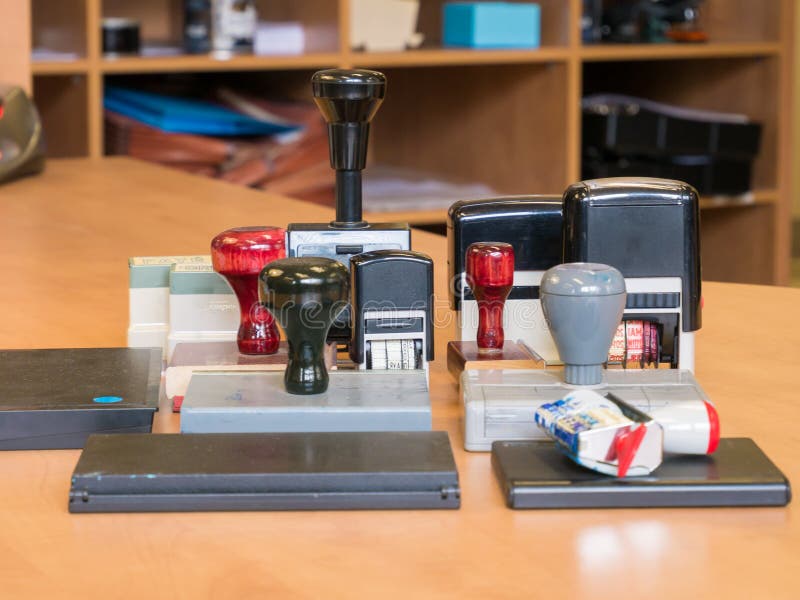 Bunch of old office stamp on a desk royalty free stock photo