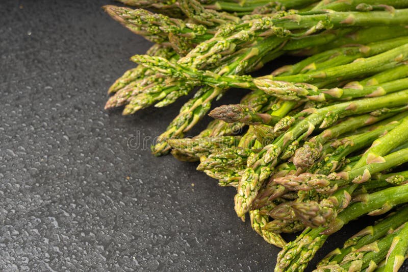 Bunch of Raw Garden Asparagus Textured Background. Fresh Green Spring Vegetables Pattern, Edible Asparagus Officinalis Sprouts