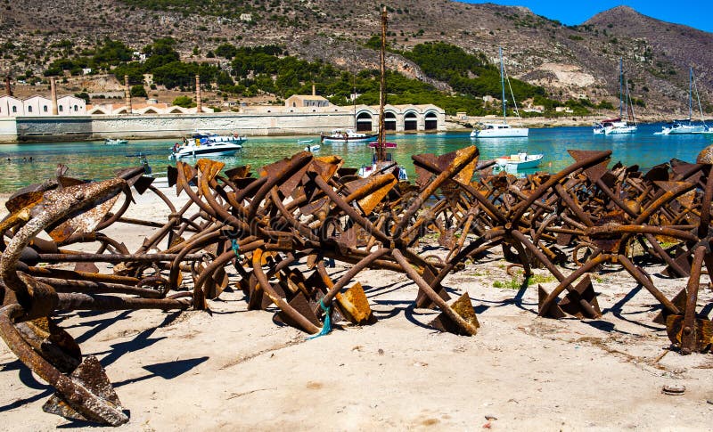 Bunch of rusty anchors in fisherman port. 