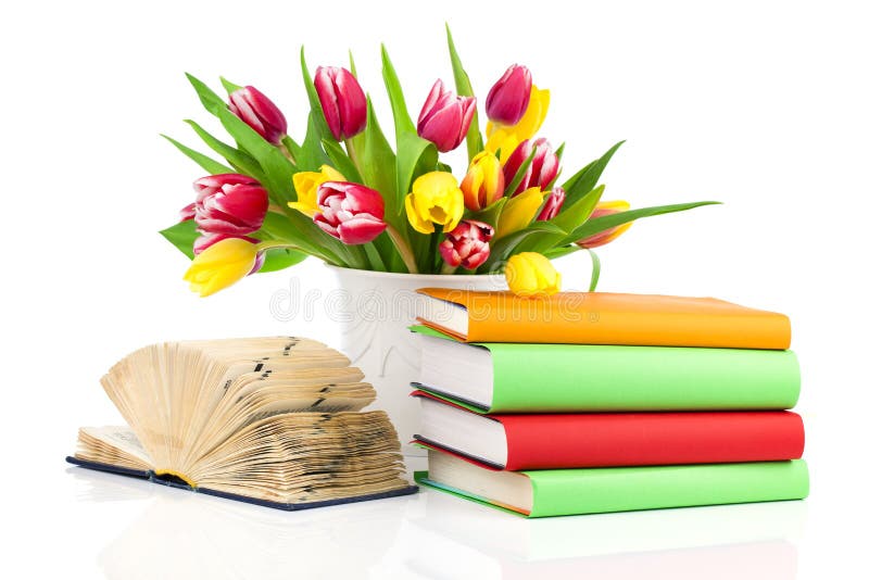 Bunch of spring tulips and books