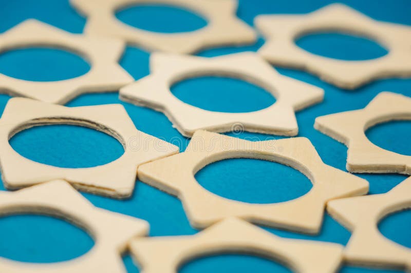 a bunch of wooden stars scattered in a chaotic manner on a blue background royalty free stock image a bunch of wooden stars scattered in a chaotic manner on a blue background royalty free stock image