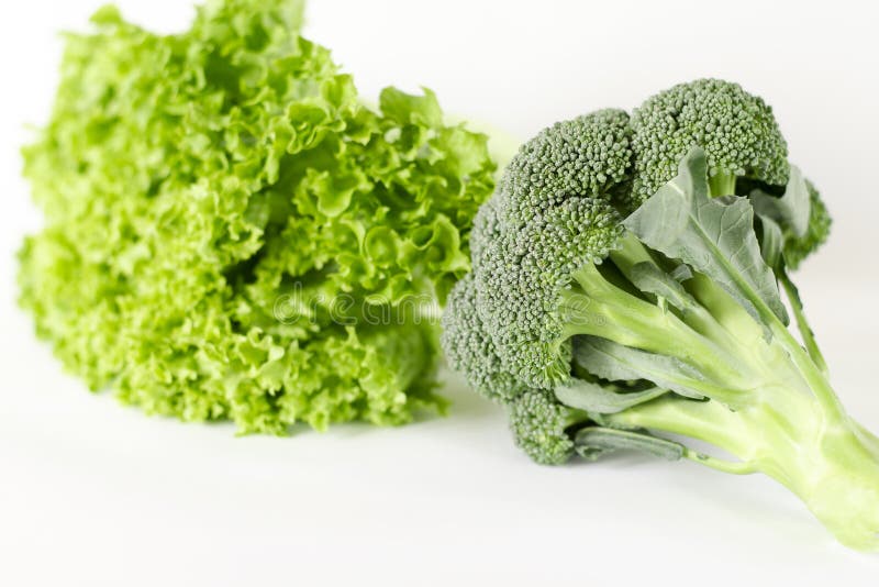 Bundle of Lettuce and Broccoli are on a White Background Stock Photo
