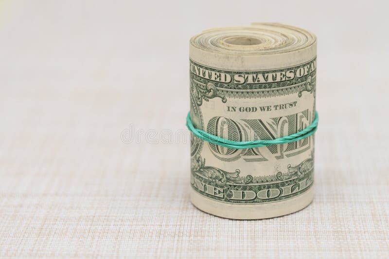 A Bundle of Money Twisted into a Bundle and Tied with a Green Rubber