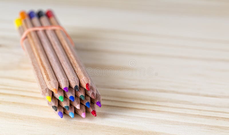 Bundle of Pencils on a Wooden Table royalty free stock images