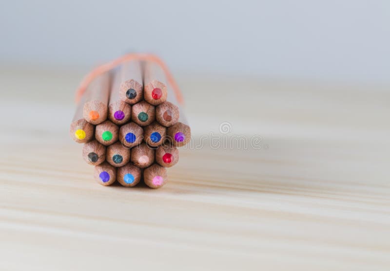 Bundle of Pencils on a Wooden Table royalty free stock images