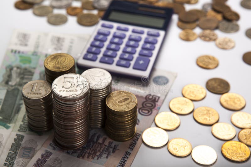 Stacks of Russian rubles with calculator close up. Stacks of Russian rubles with calculator close up