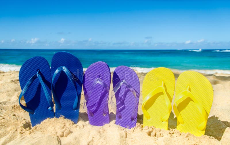 Colorful flip flops on the sandy beach in Hawaii, Kauai. Colorful flip flops on the sandy beach in Hawaii, Kauai