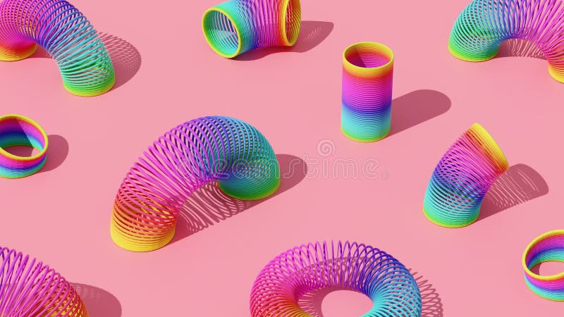 Buntes Kunststofffederspielzeug auf rosa Untergrund. lizenzfreie abbildung
