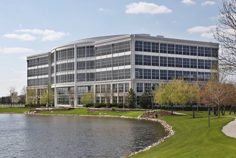 Five story office building with lake in suburbs. Five story office building with lake in suburbs