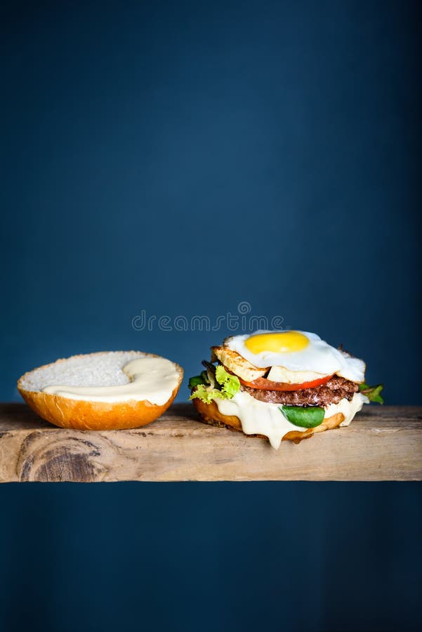 Burger with Egg and Beef, Microgreens and Aioli. Hamburger, Fast Food