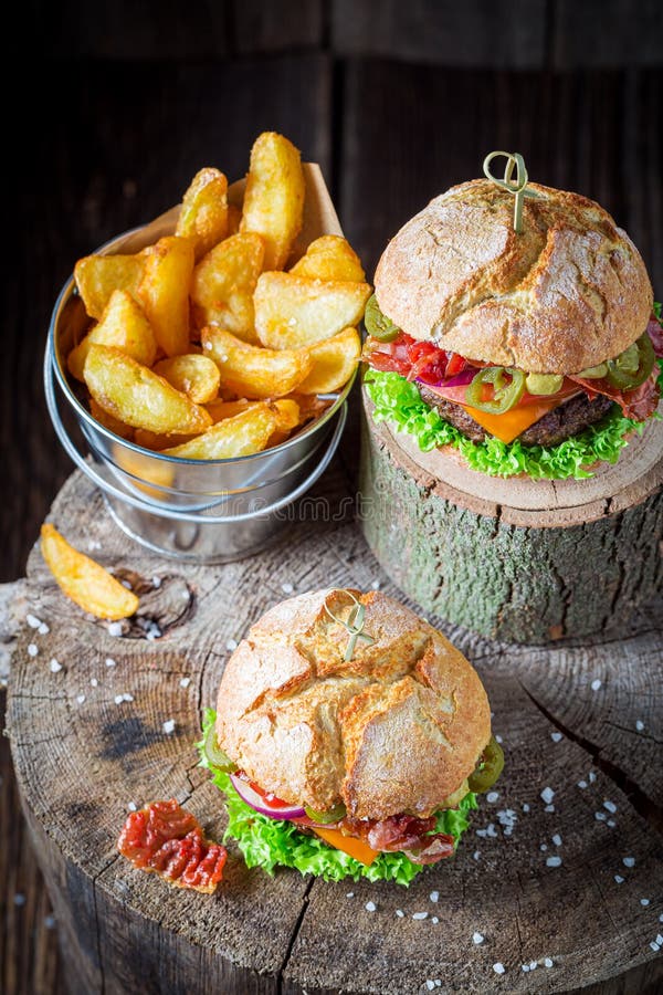 Burger made of beef, vegetables and cheese. American cuisine stock image