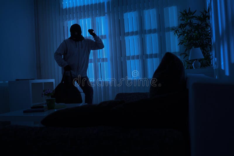 Burglar with flashlight and crow bar royalty free stock photo Burglar with flashlight and crow bar royalty free stock photo