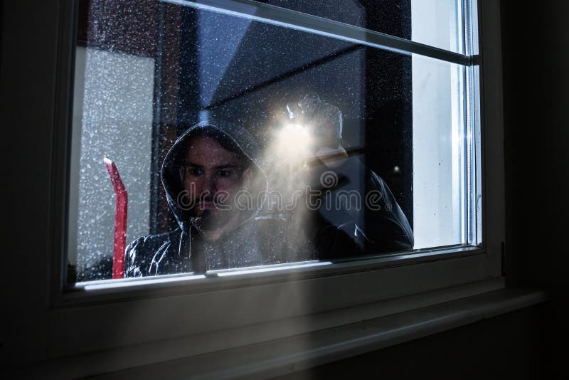 Burglar Looking into a House Window Stock Photo - Image of alarm ...
