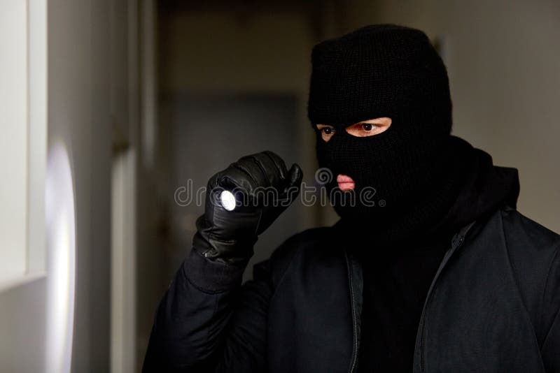Burglar at Night with Flashlight and Balaclava Stock Photo - Image of ...