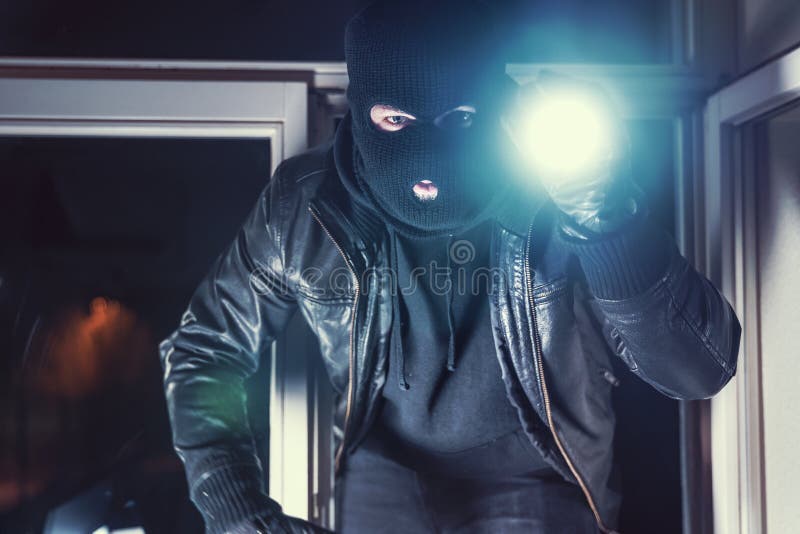 Burglar with torch