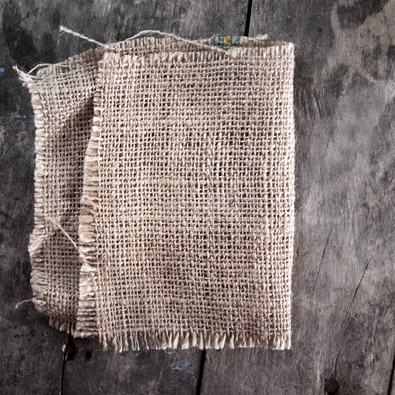 Burlap texture on wooden table background